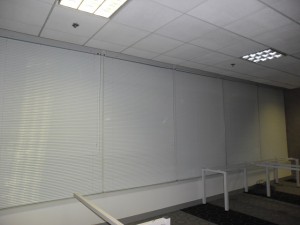 White Color of Venetian Blinds Installation in an Office