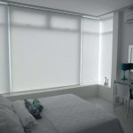 White Roller Blinds Installed in a Relaxing White Bedroom