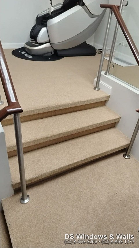 beige carpet roll installed on a residential staircase